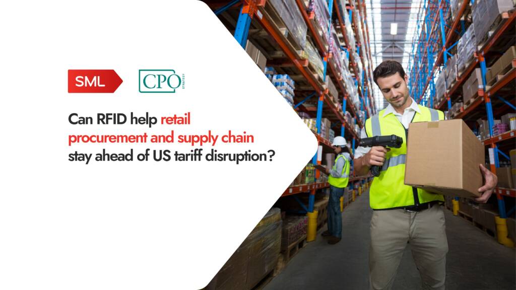 Worker scanning box with RFID in retail warehouse.